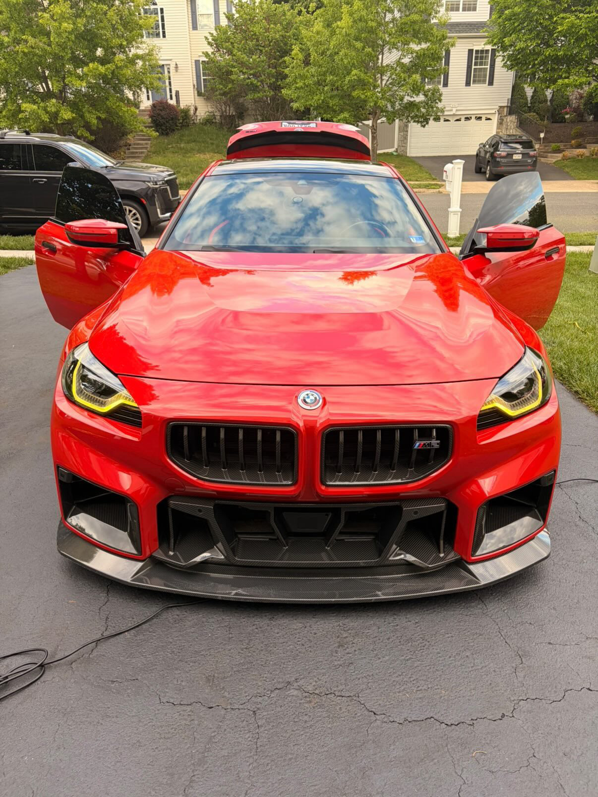 Red BMW M2 exterior doors open