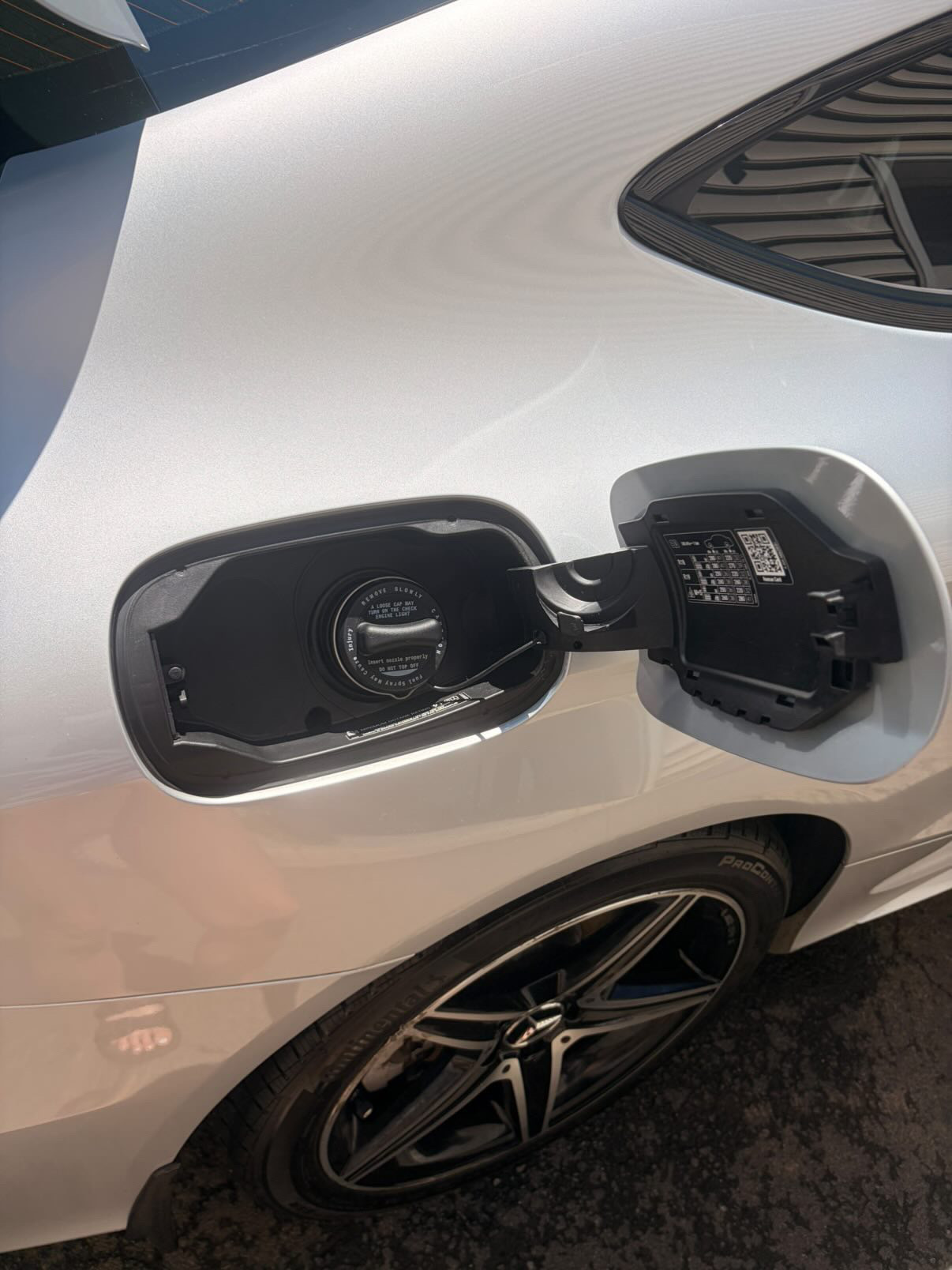 Mercedes AMG wheel and fuel door cleaned